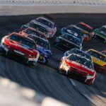 NASCAR Cup Series cars racing at a short track